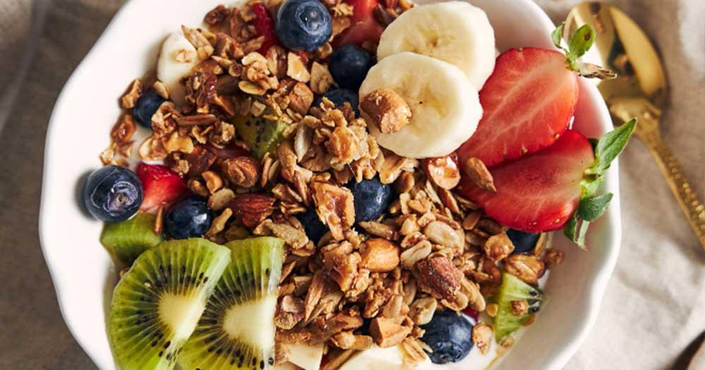 eating healthy granola snacks and fruits for fitness